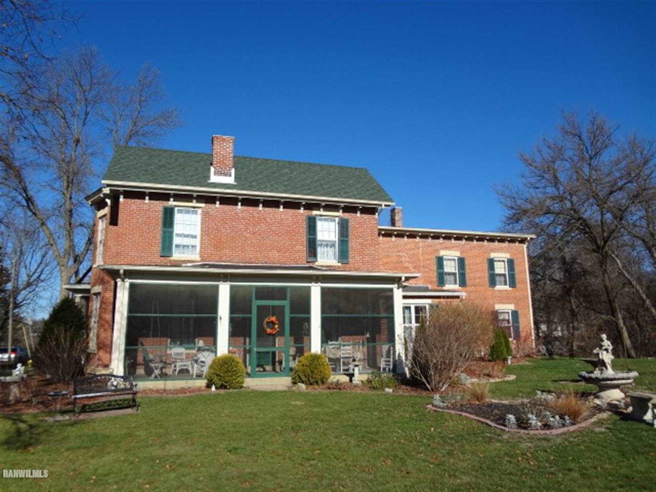 900 3rd Street Galena, IL 61036 - Photo 6 of 6 a front view of a house with a yard garden and outdoor seating