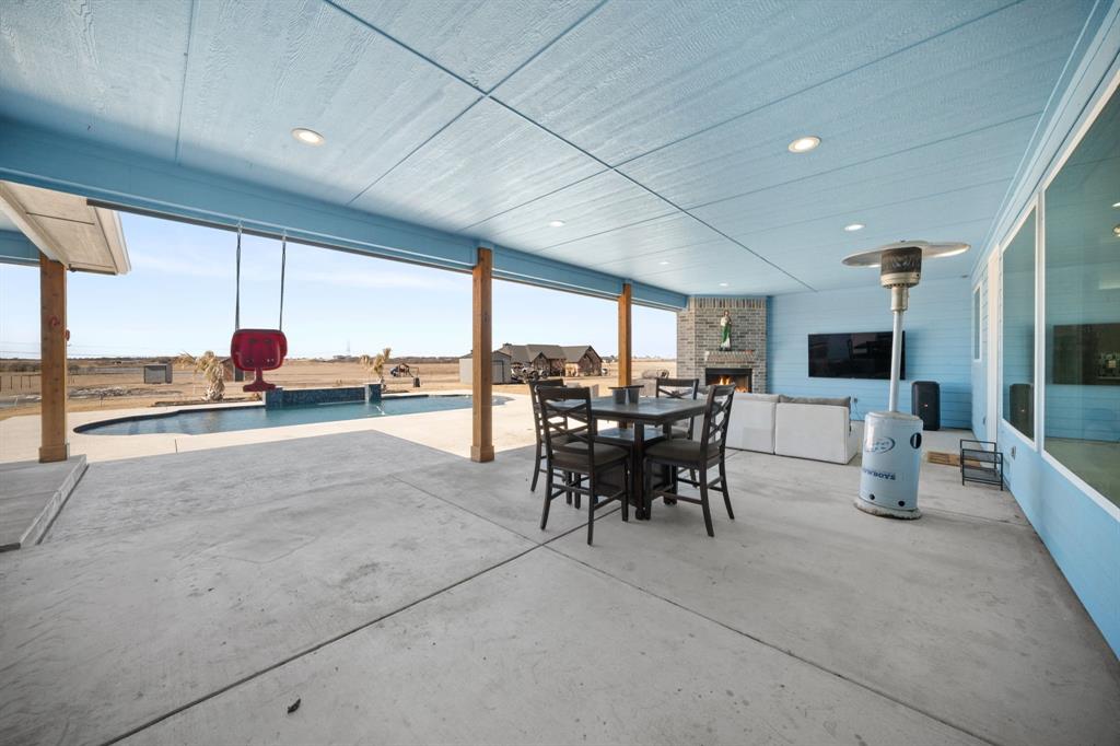 10405 Singleton Road Midlothian, TX 76065 - Photo 27 of 39 View of patio / terrace featuring outdoor dining space and an outdoor pool