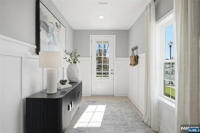 a bathroom with a sink a mirror and a shower