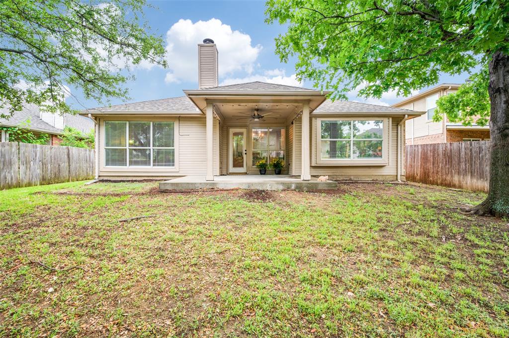7306 Vista Ridge Lane Sachse, TX 75048 - Photo 20 of 23 a front view of a house with garden