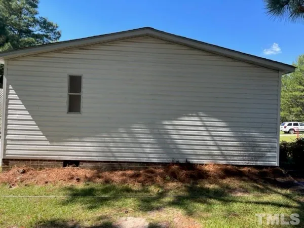 a view of a backyard of the house
