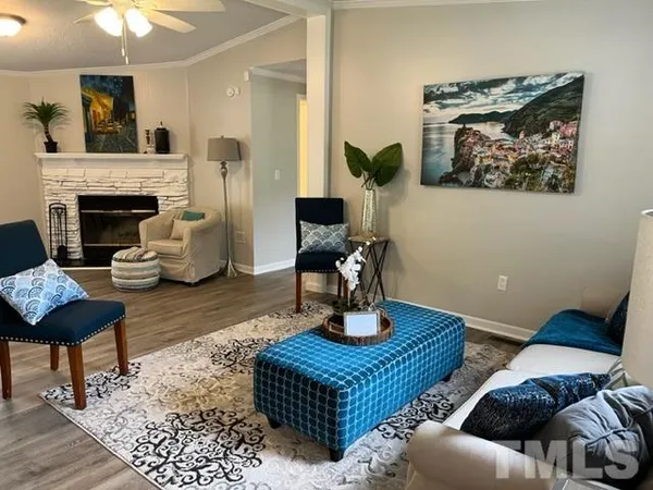 a living room with furniture and a fireplace