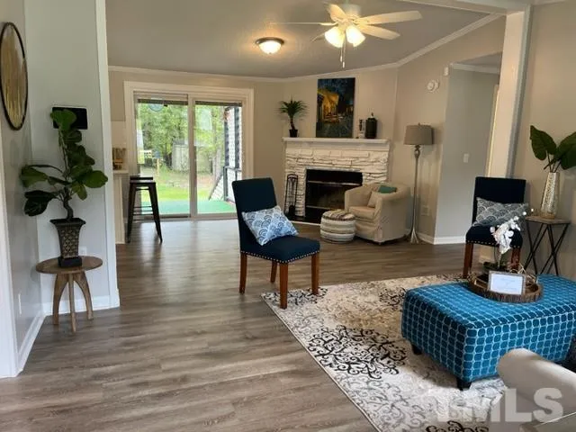 a living room with furniture and a fireplace