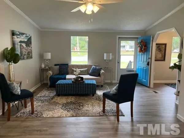 a living room with furniture and a window