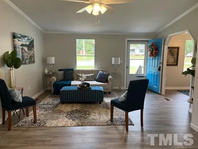 a living room with furniture and a window