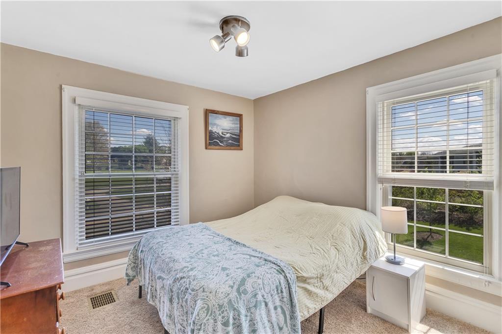 1226 Mayview Road Pittsburgh, PA 15241 - Photo 28 of 42 A comfortable and versatile bedroom, perfect for guests, family, or a home office.