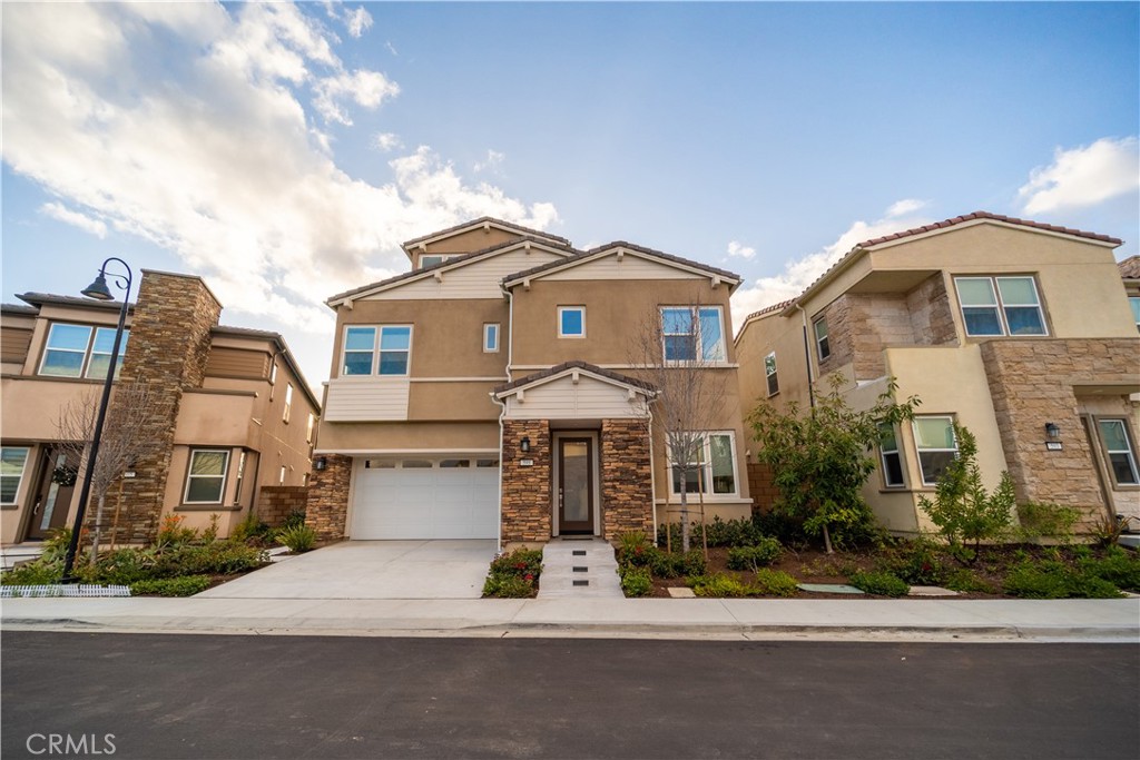 599 Serrano Summit Drive Lake Forest, CA 92630 - Photo 1 of 31 a front view of a house with a yard
