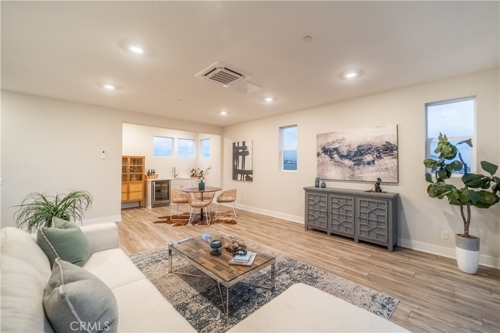 599 Serrano Summit Drive Lake Forest, CA 92630 - Photo 12 of 31 a living room with furniture potted plant and open kitchen view