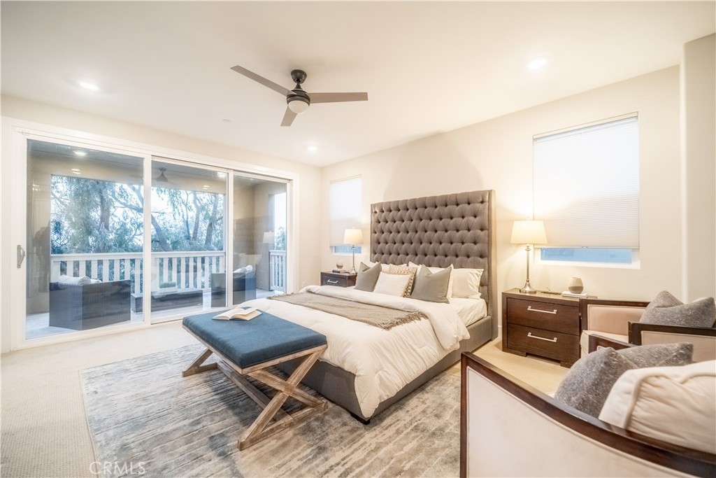 599 Serrano Summit Drive Lake Forest, CA 92630 - Photo 13 of 31 a bedroom with a bed a large window and wooden floor