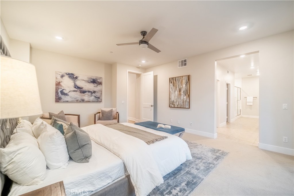 599 Serrano Summit Drive Lake Forest, CA 92630 - Photo 14 of 31 a bedroom with a bed and a painting on the wall