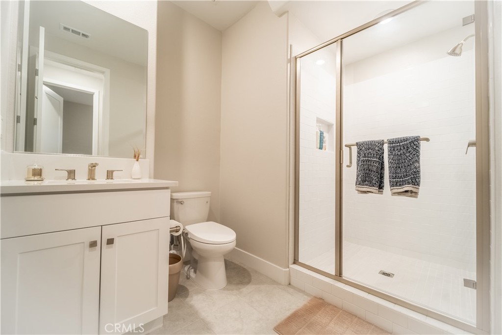 599 Serrano Summit Drive Lake Forest, CA 92630 - Photo 18 of 31 a bathroom with a sink toilet and shower