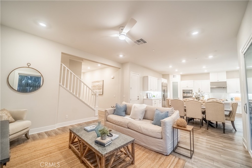 599 Serrano Summit Drive Lake Forest, CA 92630 - Photo 2 of 31 a living room with furniture and wooden floor