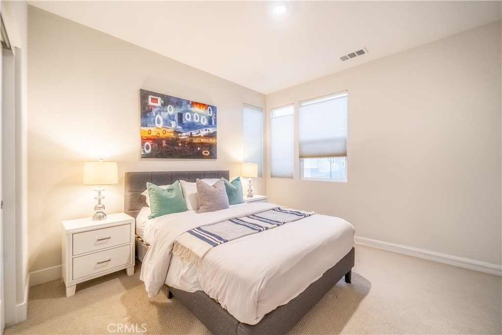 599 Serrano Summit Drive Lake Forest, CA 92630 - Photo 22 of 31 a bedroom with a bed and a window