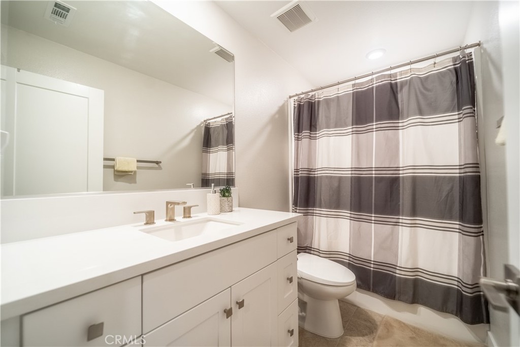 599 Serrano Summit Drive Lake Forest, CA 92630 - Photo 23 of 31 a bathroom with a sink a toilet and shower