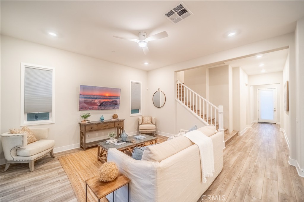 599 Serrano Summit Drive Lake Forest, CA 92630 - Photo 3 of 31 a living room with furniture and a wooden floor