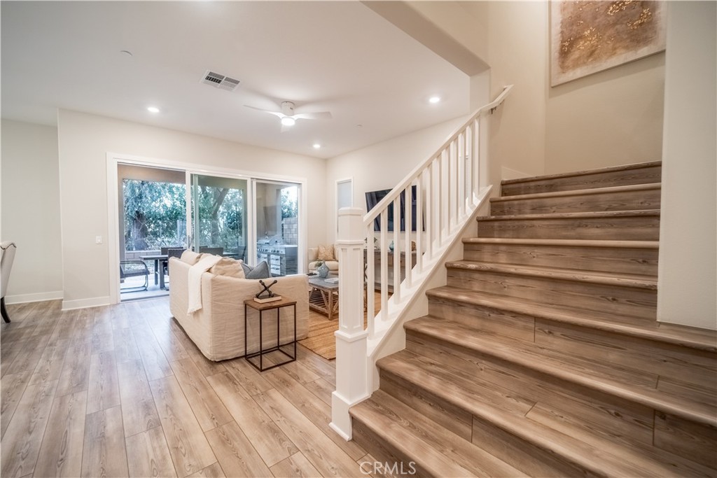 599 Serrano Summit Drive Lake Forest, CA 92630 - Photo 8 of 31 a living room with furniture and wooden floor