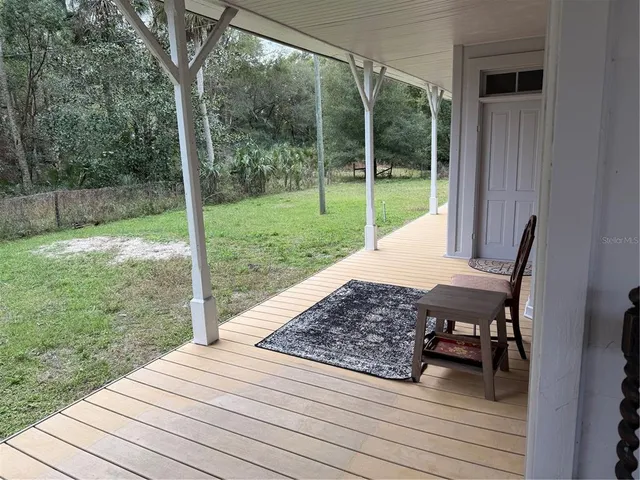 a view of an entryway with a mirror