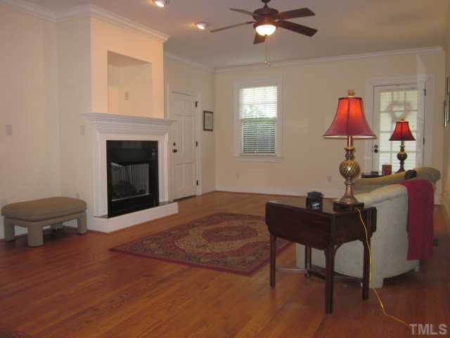 1115 Wake Forest Road, Unit A Raleigh, NC 27604 - Photo 11 of 25 a living room with furniture and a fireplace