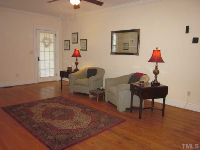1115 Wake Forest Road, Unit A Raleigh, NC 27604 - Photo 12 of 25 a living room with furniture and a wooden floor