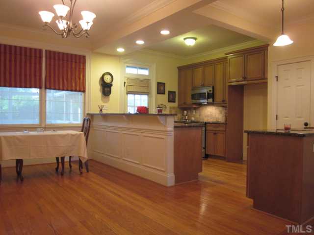 1115 Wake Forest Road, Unit A Raleigh, NC 27604 - Photo 15 of 25 a kitchen that has a lot of cabinets a sink and appliances in it