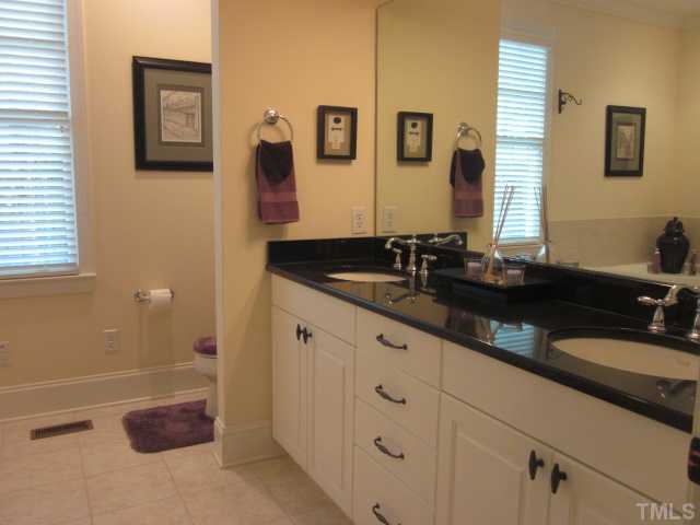 1115 Wake Forest Road, Unit A Raleigh, NC 27604 - Photo 20 of 25 a bathroom with a sink and a mirror
