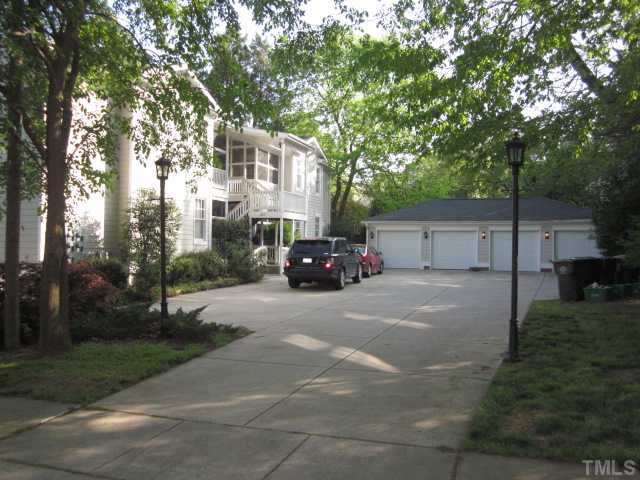 1115 Wake Forest Road, Unit A Raleigh, NC 27604 - Photo 5 of 25 a front view of a house with a garden