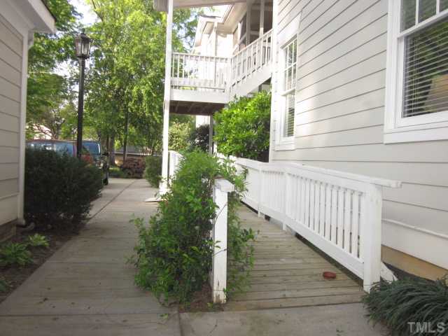 1115 Wake Forest Road, Unit A Raleigh, NC 27604 - Photo 6 of 25 a view of a pathway of a house with backyard and garden