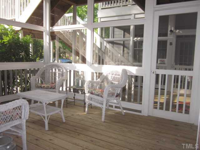 1115 Wake Forest Road, Unit A Raleigh, NC 27604 - Photo 8 of 25 a view of a patio with table and chairs and wooden floor