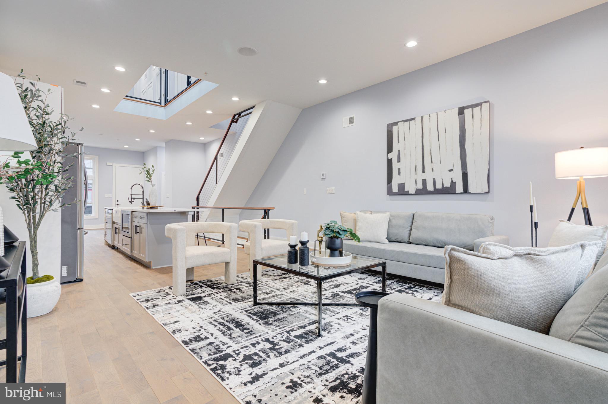 2318 East Hazzard Street Philadelphia, PA 19125 - Photo 12 of 44 a living room with furniture and view of kitchen
