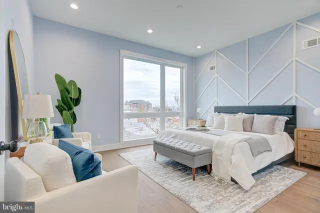 a bedroom with a bed and a couch