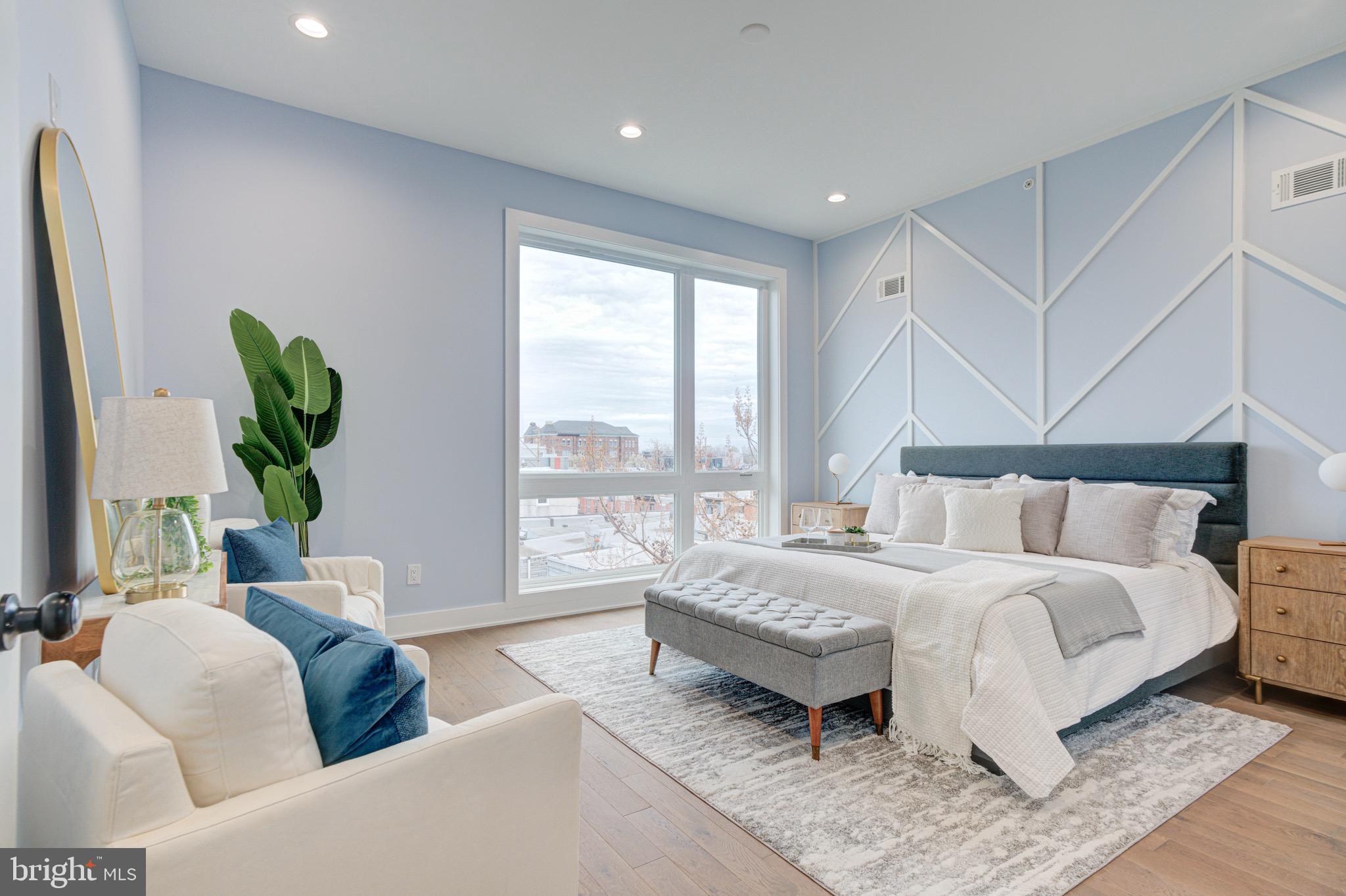 2318 East Hazzard Street Philadelphia, PA 19125 - Photo 14 of 44 a bedroom with a bed and a couch