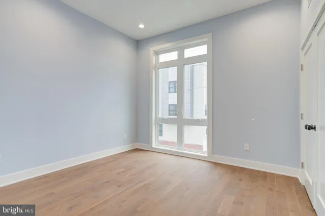 wooden floor and window in an empty room