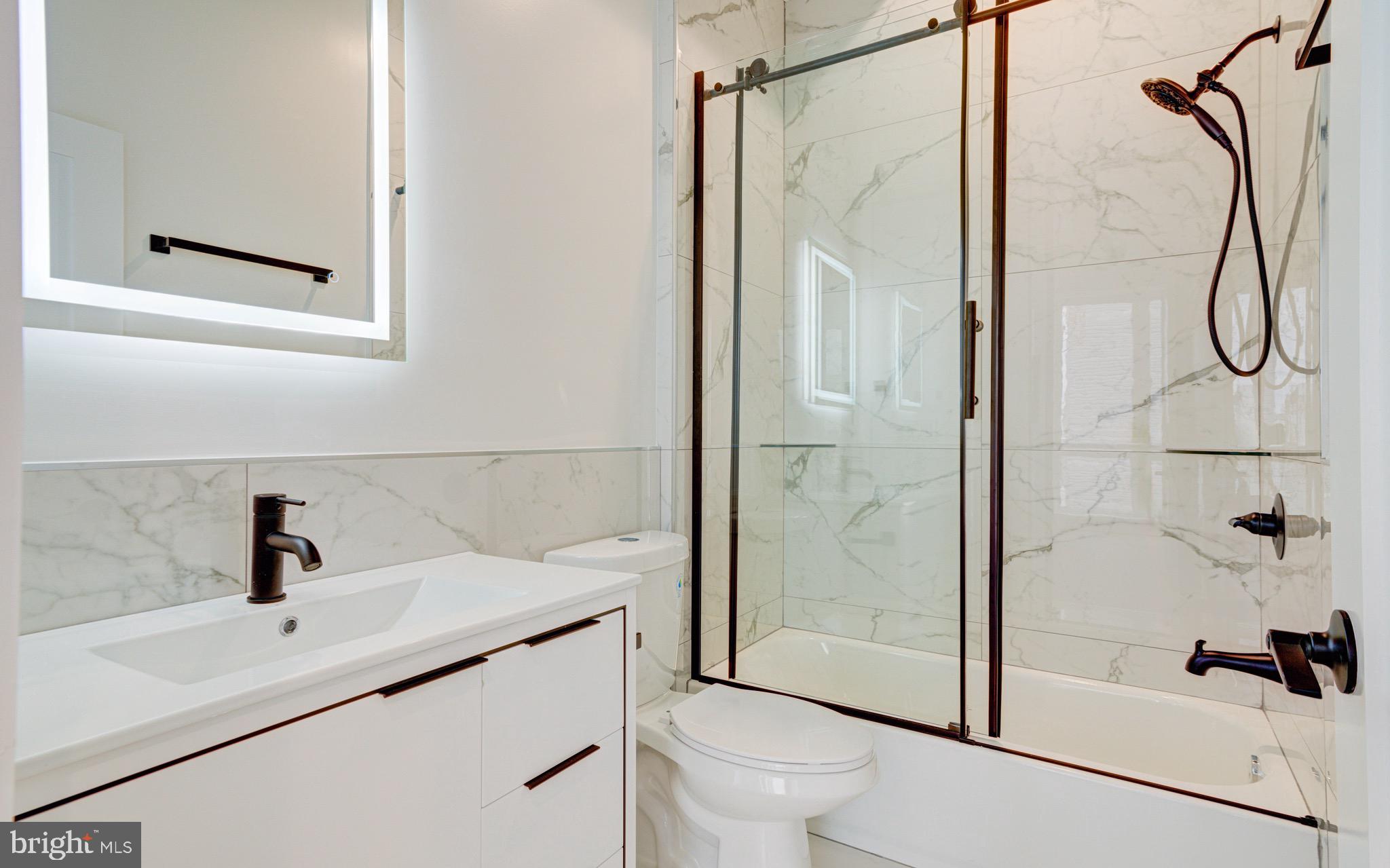 2318 East Hazzard Street Philadelphia, PA 19125 - Photo 23 of 44 a bathroom with a sink toilet and shower