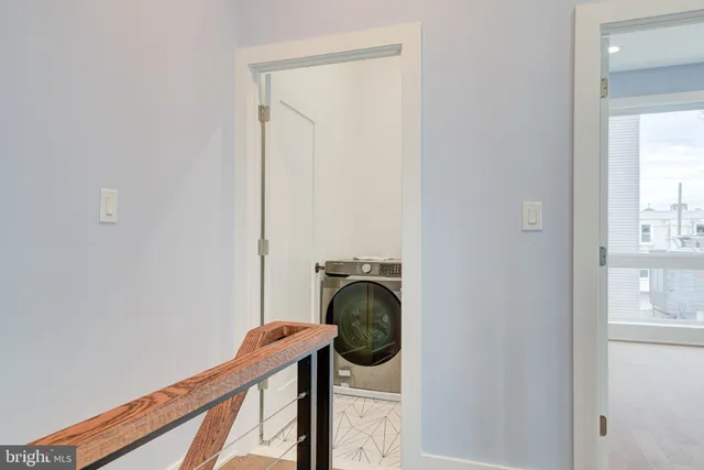 wooden floor with white cabinets and wooden floor