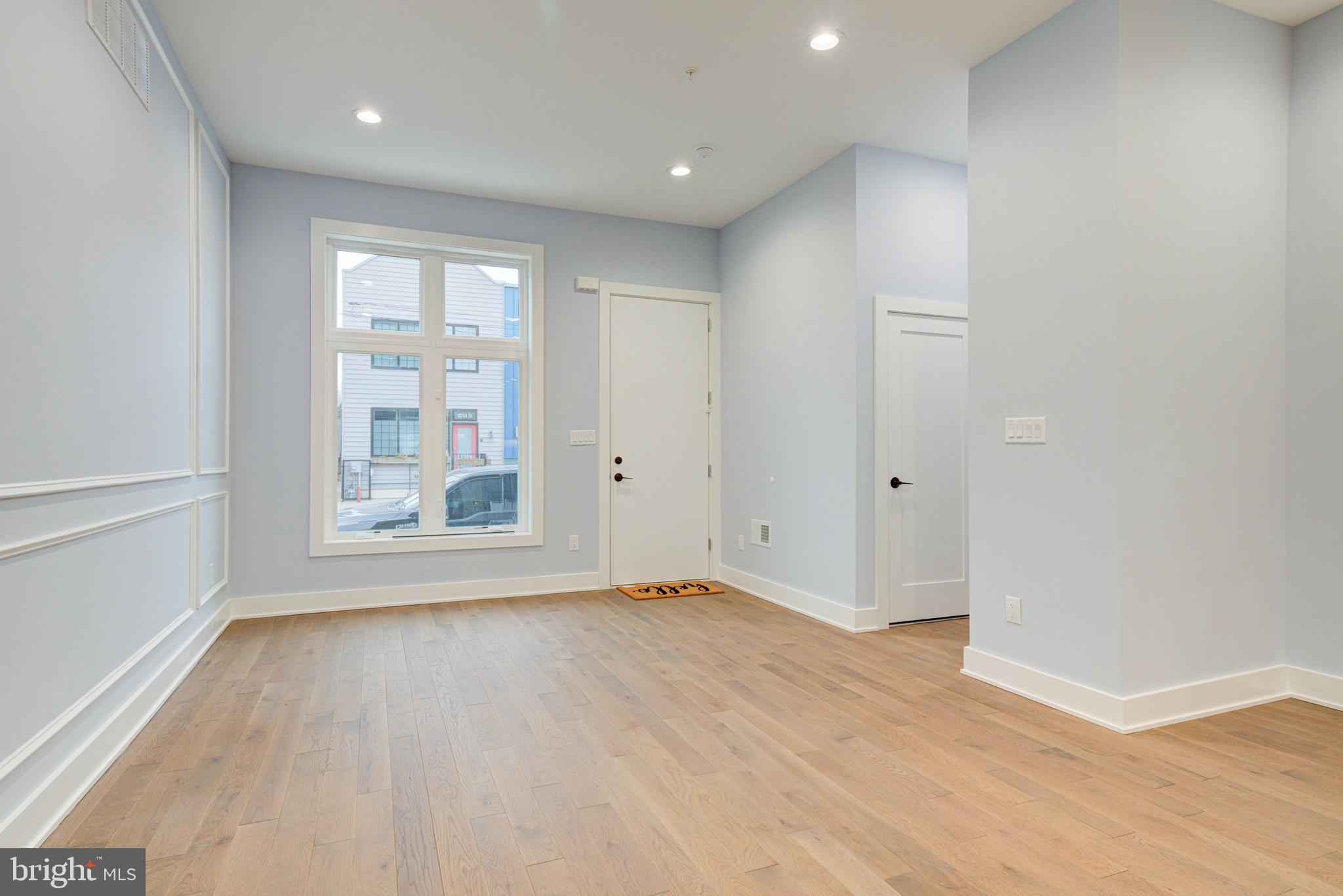 2318 East Hazzard Street Philadelphia, PA 19125 - Photo 31 of 44 wooden floor in an empty room with a window