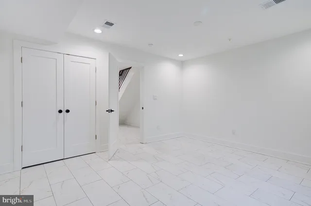 an empty room with windows