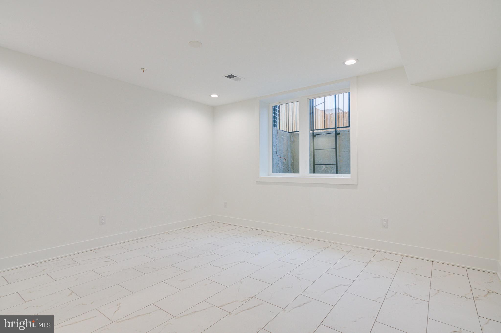 2318 East Hazzard Street Philadelphia, PA 19125 - Photo 33 of 44 an empty room with windows
