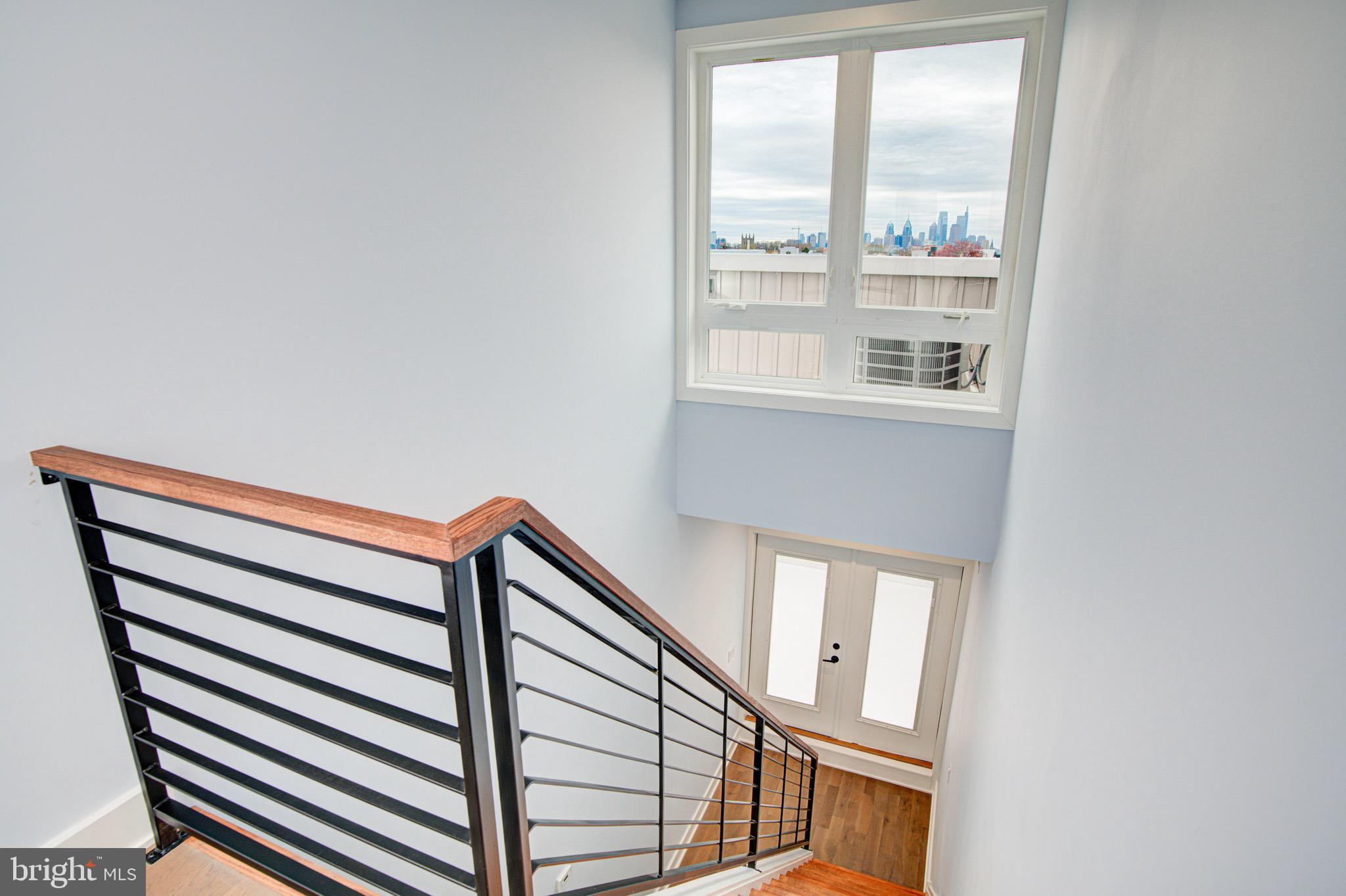 2318 East Hazzard Street Philadelphia, PA 19125 - Photo 36 of 44 a view of staircase with rug door