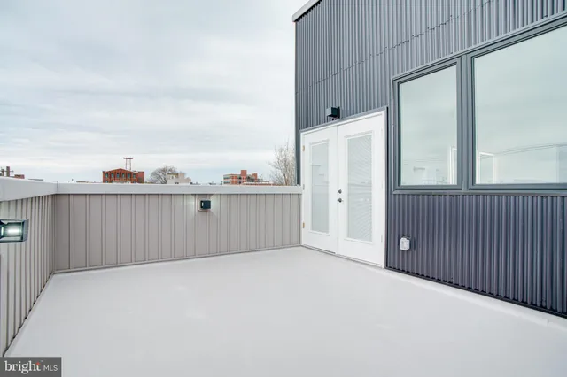 a view of a kitchen with a sink and cabinets