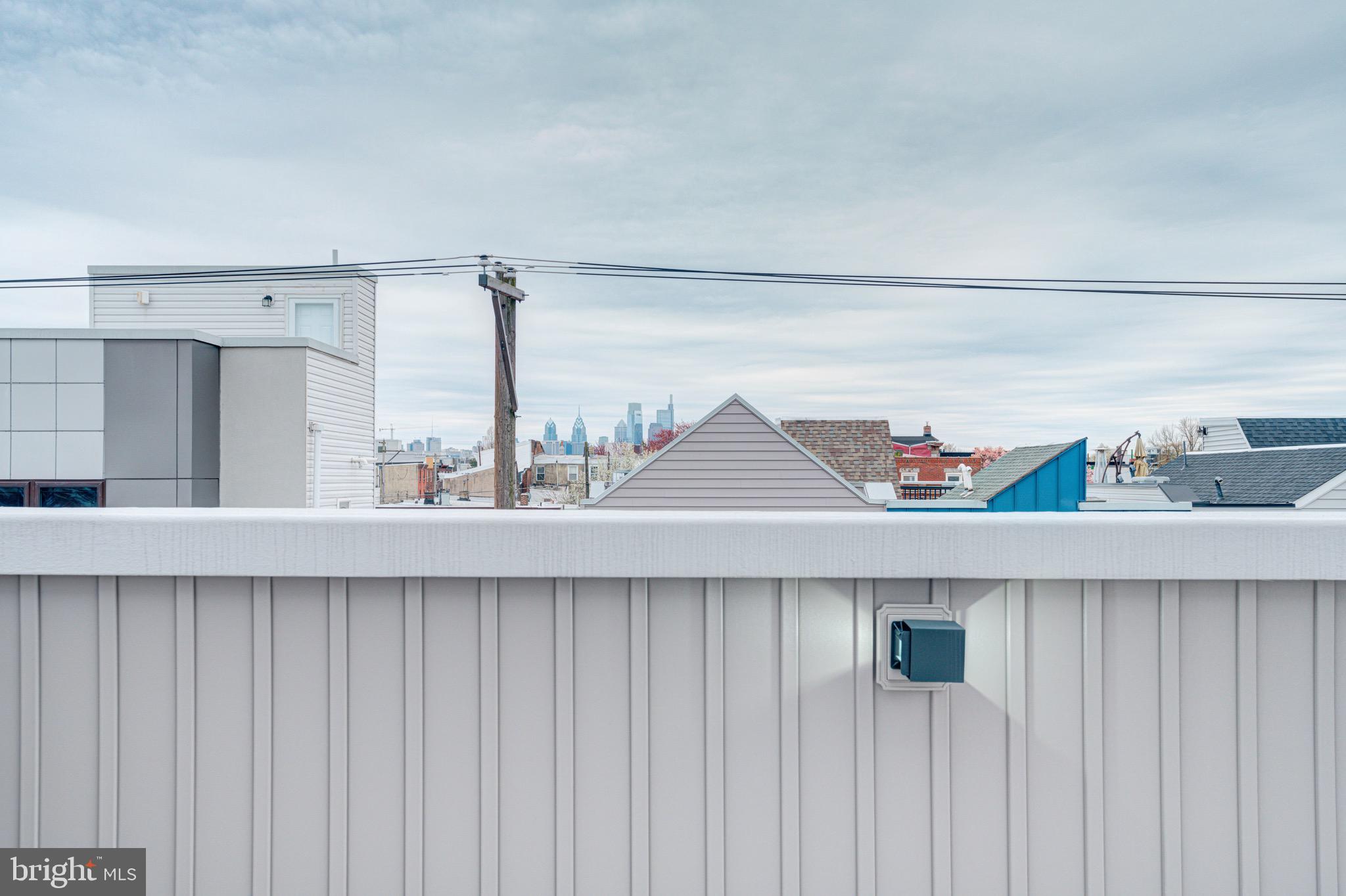 2318 East Hazzard Street Philadelphia, PA 19125 - Photo 42 of 44 a kitchen with a sink a refrigerator and cabinets