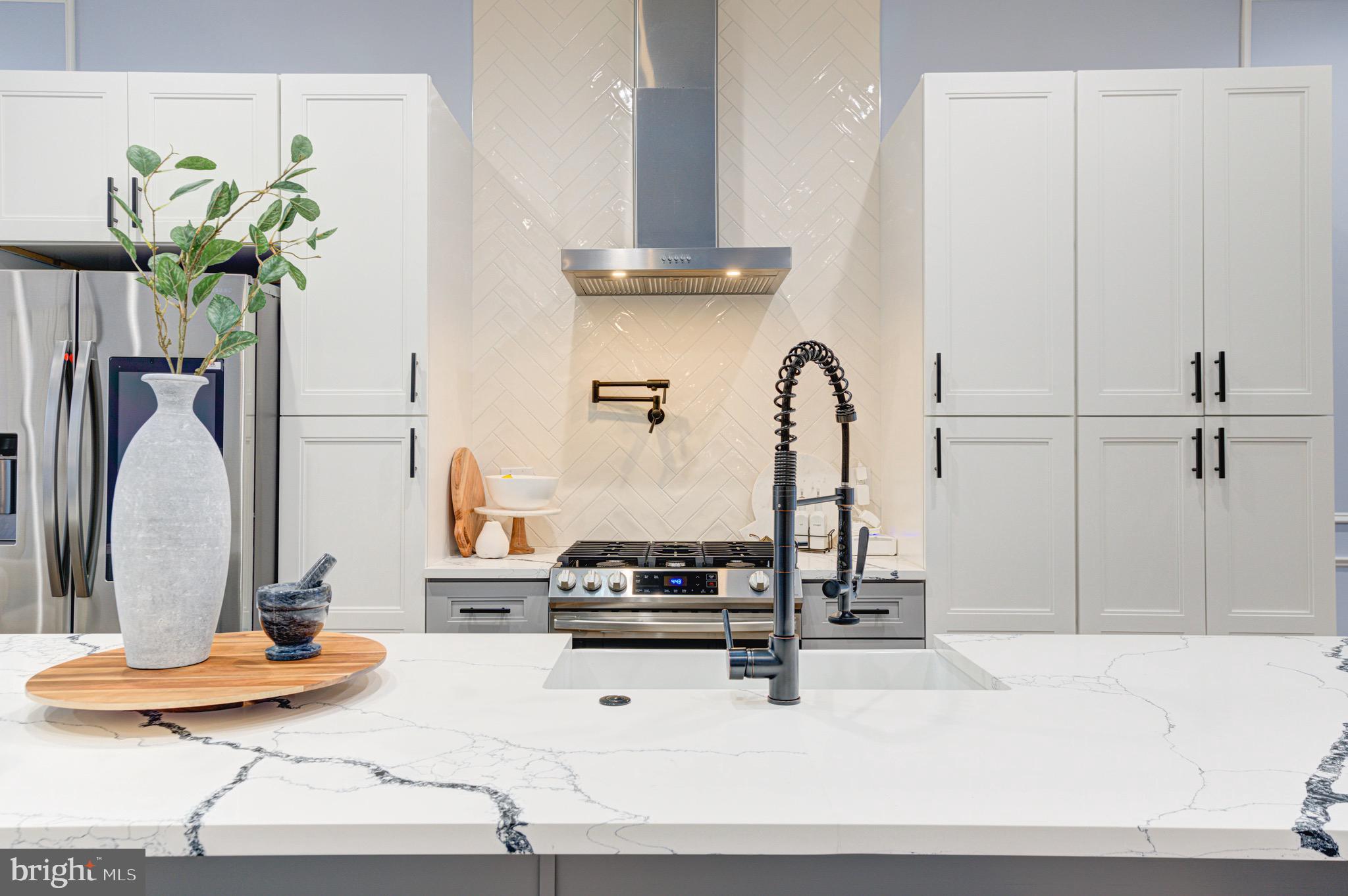2318 East Hazzard Street Philadelphia, PA 19125 - Photo 8 of 44 a kitchen with a refrigerator and ceiling fan