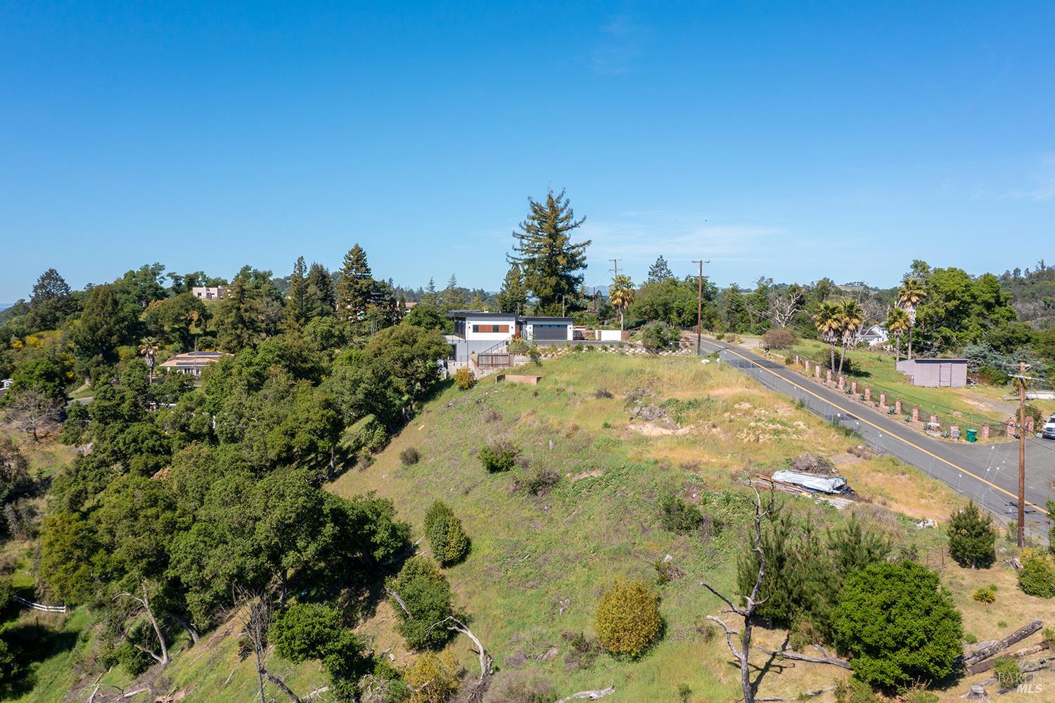 1111 Wikiup Drive Santa Rosa, CA 95403 - Photo 10 of 15 a view of a swimming pool with lawn chairs and wooden fence