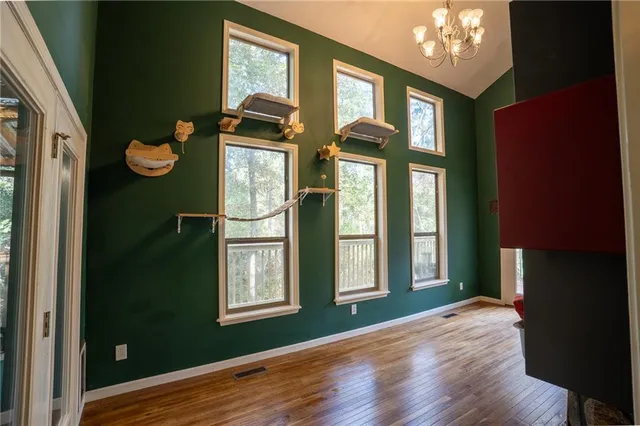 a view of an entryway with wooden floor