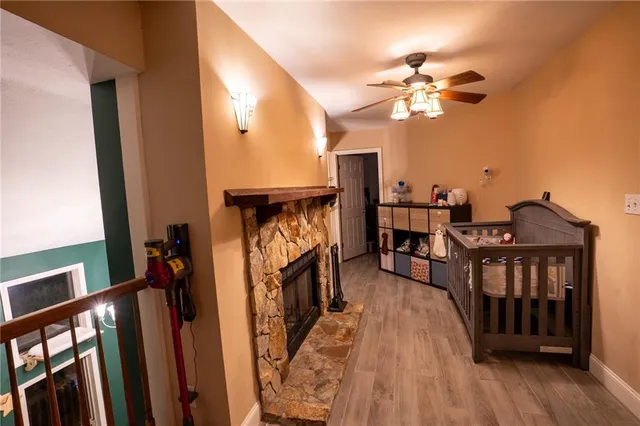 a view of a livingroom with furniture and hardwood floor