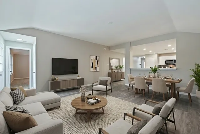 a bathroom with a granite countertop sink a toilet and a mirror
