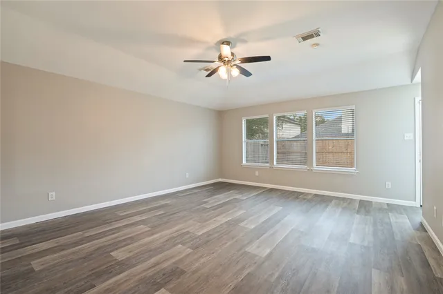 a bathroom with a granite countertop sink and a vanity
