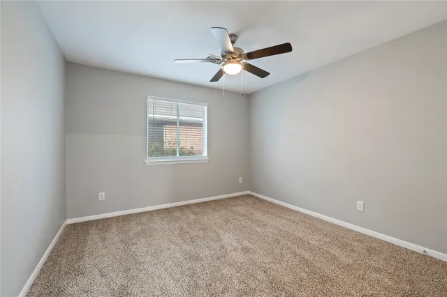 a view of house with backyard and outdoor seating