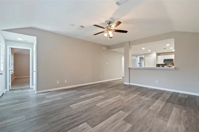 a view of an empty room with a window