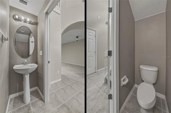 a bathroom with a toilet and a sink