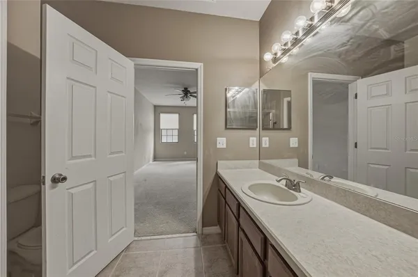 a bathroom with a sink double vanity granite and shower